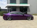 A purple Ford Falcon with tinted windows